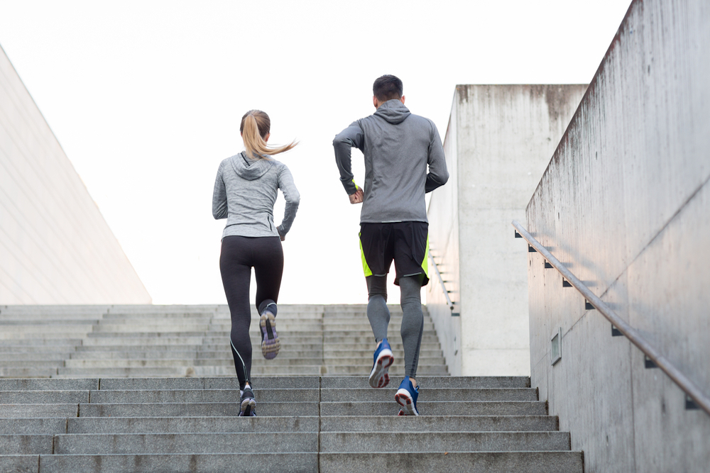 couple running up stairs