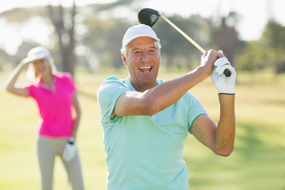 Man swinging a golf club